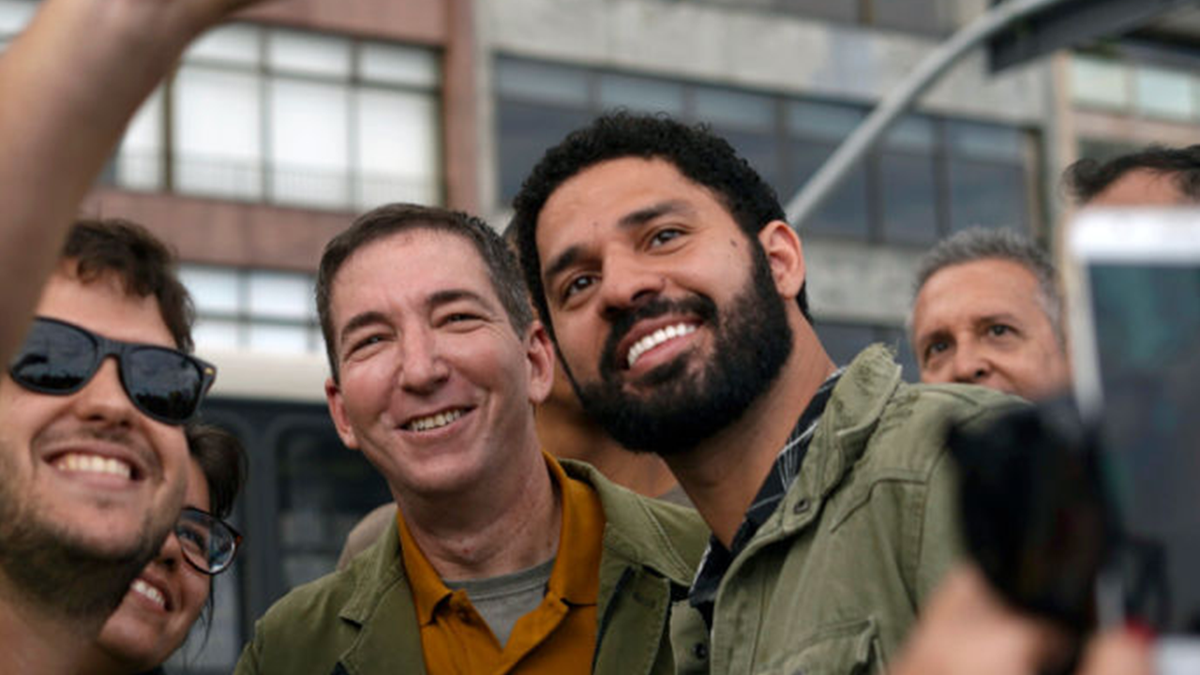 Greenwald and his husband photographed