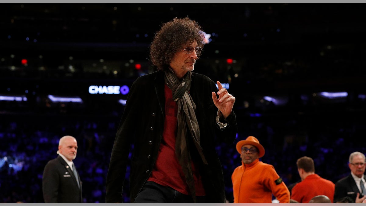 Howard Stern walks courtside