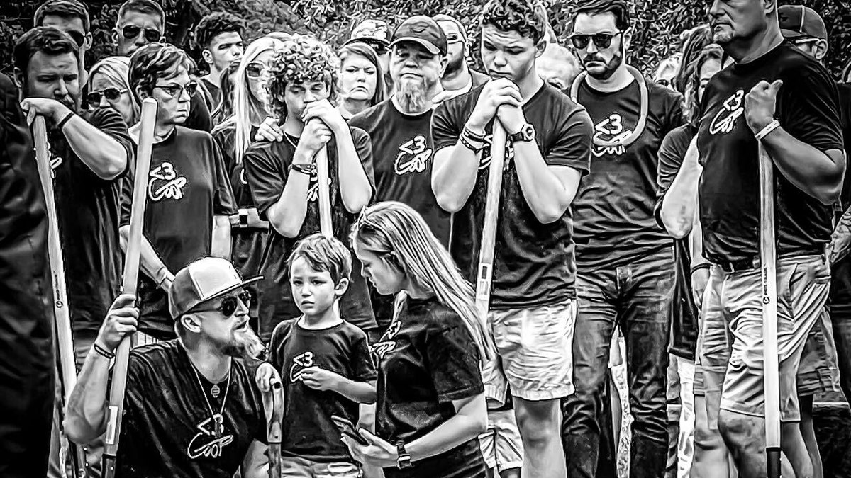 The Guffey family gathers at Gavin's funeral holding shovles