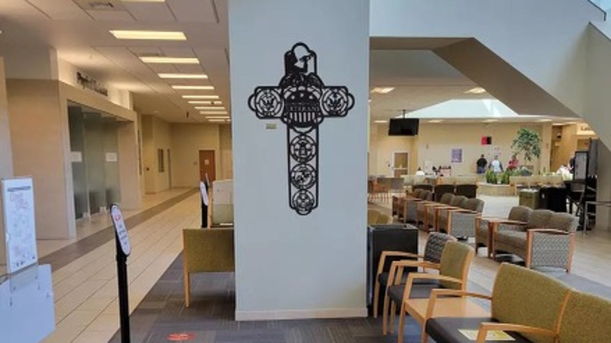 cross-shaped sign in veterans facility lobby