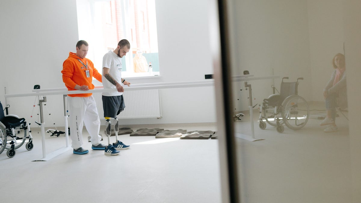 Denys Kryvenko, right, is one of the first dozen patients undergoing rehabilitation at the Superhumans Center – a newly established medical center aiming to become Ukraine’s first venue for reconstruction surgeries. Before the Superhumans Center was established, patients had to travel to Europe and the U.S. for treatment.