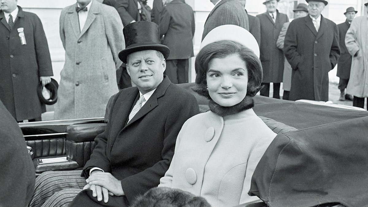 Jackie Kennedy and JFK in a convertible