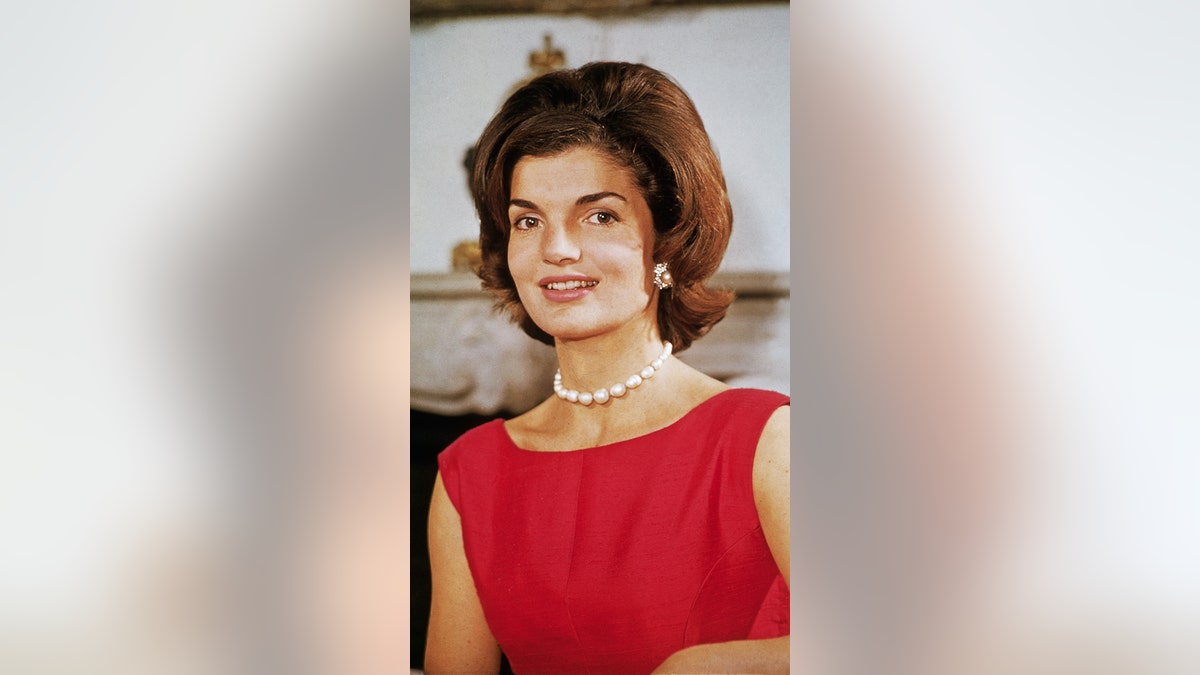 Jackie Kennedy red dress smiling
