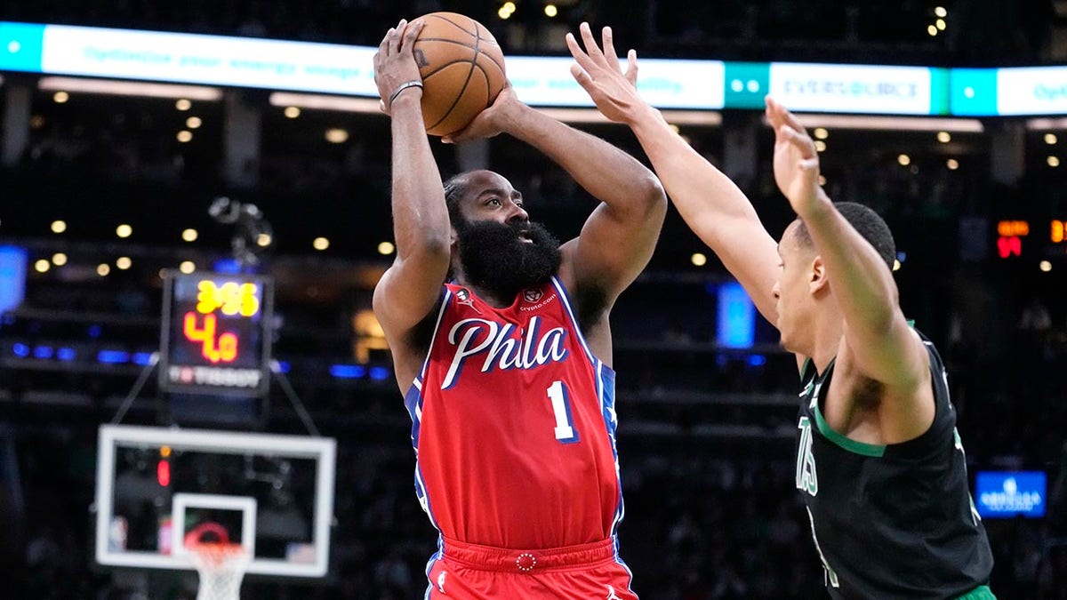 James Harden shoots over Malcolm Brogdon