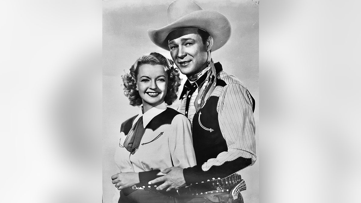 Julie Rogers and Dale Evans posing together in cowboy gear
