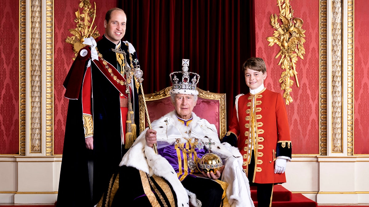 King Charles III in full regalia with Princes William and George