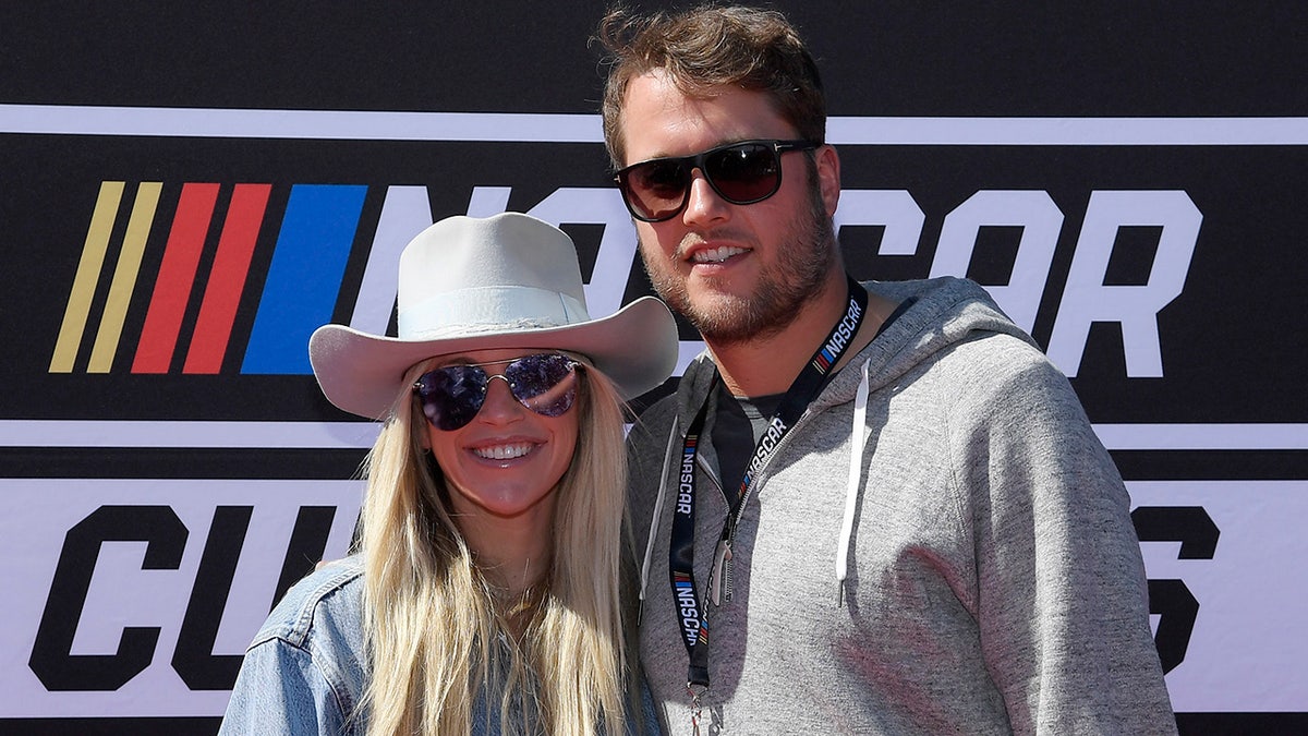 Kelly and Matthew Stafford at a NASCAR race