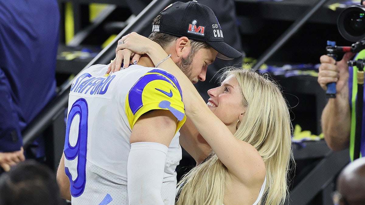 Kelly Stafford hugs her husband