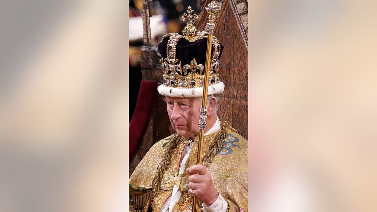 King Charles III with crown and scepter at coronation
