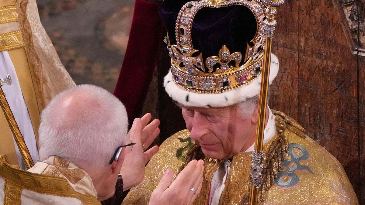 King Charles III is crowned with St Edwards Crown by The Archbishop of Canterbury