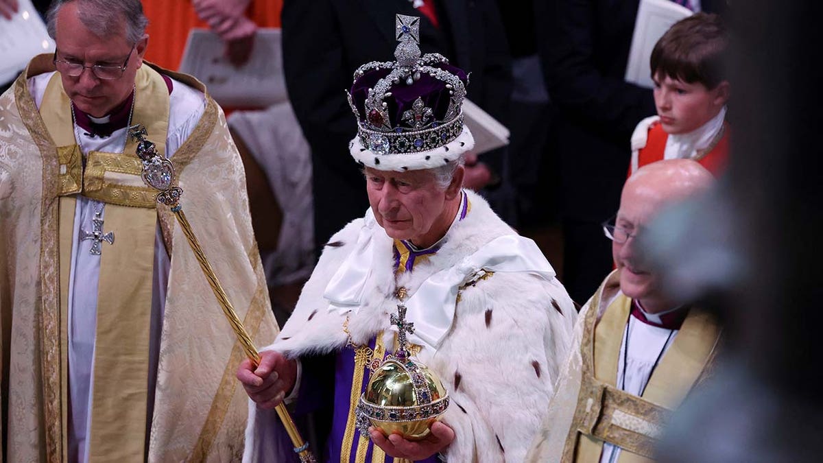 Britains King Charles departs following their coronation ceremony at Westminster Abbey