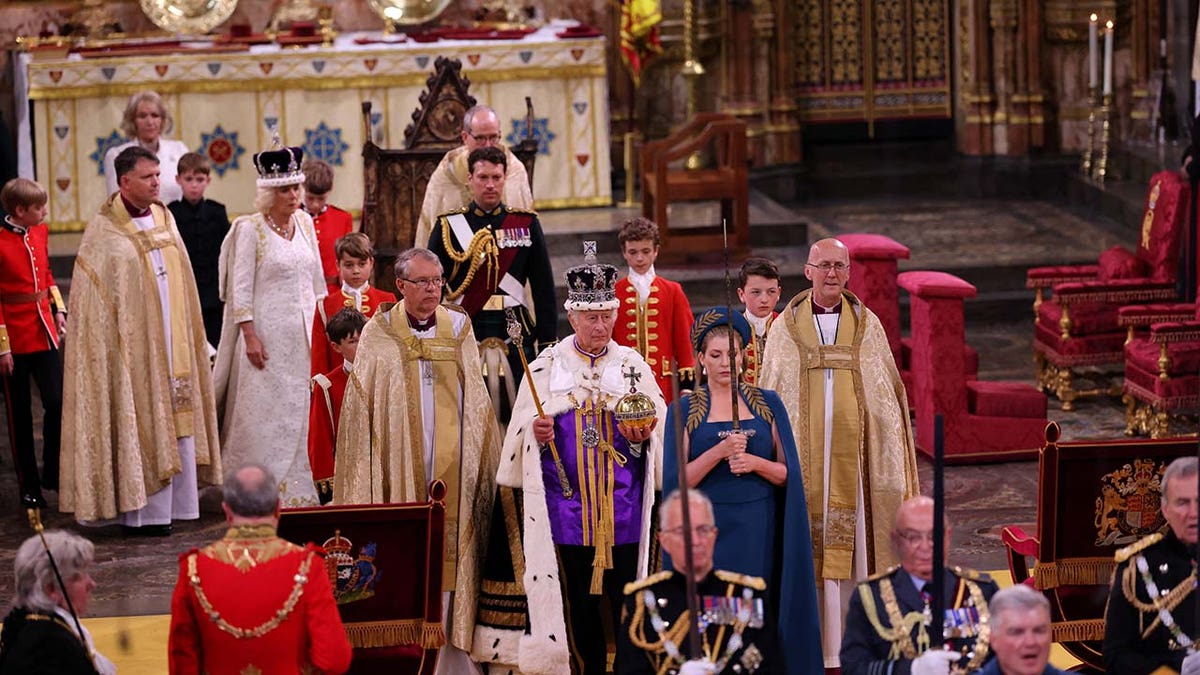 Britain's King Charles walks in the Coronation Procession after his coronation ceremony at Westminster Abbey