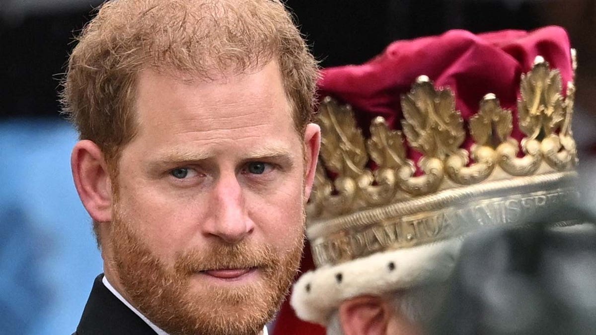 Britain's Prince Harry walks outside Westminster Abbey