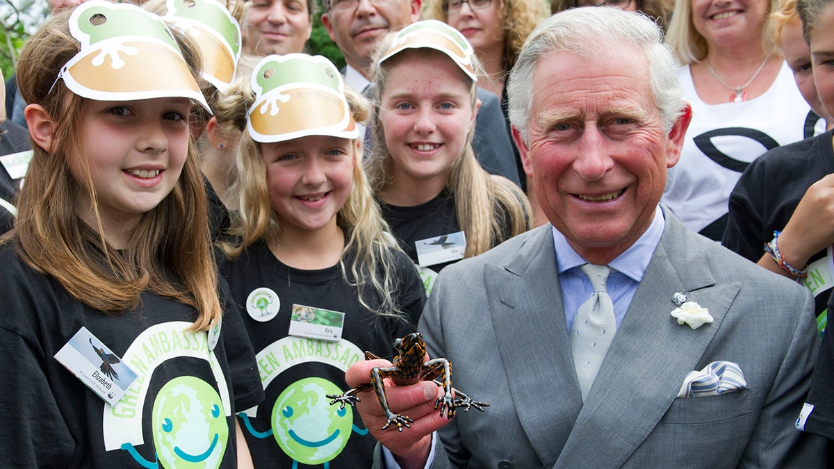 King Charles holding his frog species at WWF Green Ambassadors Scheme