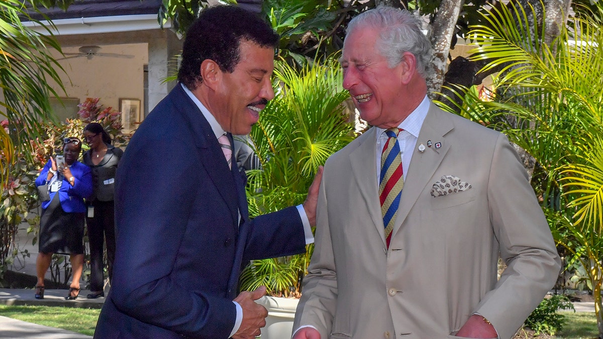 King Charles and Lionel Richie laughing together in Barbados