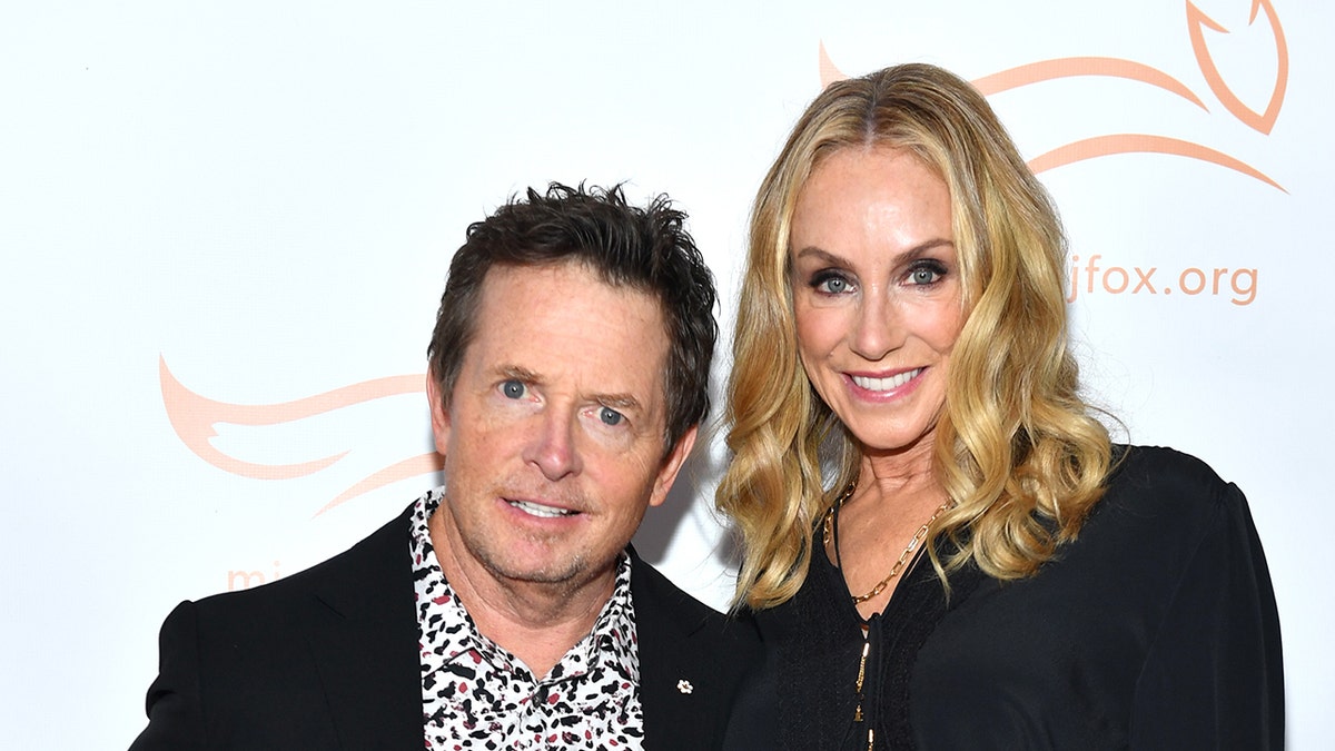 Michael J. Fox smiling with his wife Tracy Pollan