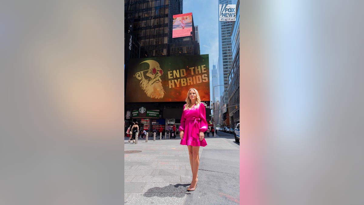 Ashley Baustert, mother of Madison Brooks, stands in front of a billboard for the Madison Brooks Foundation in Times Square