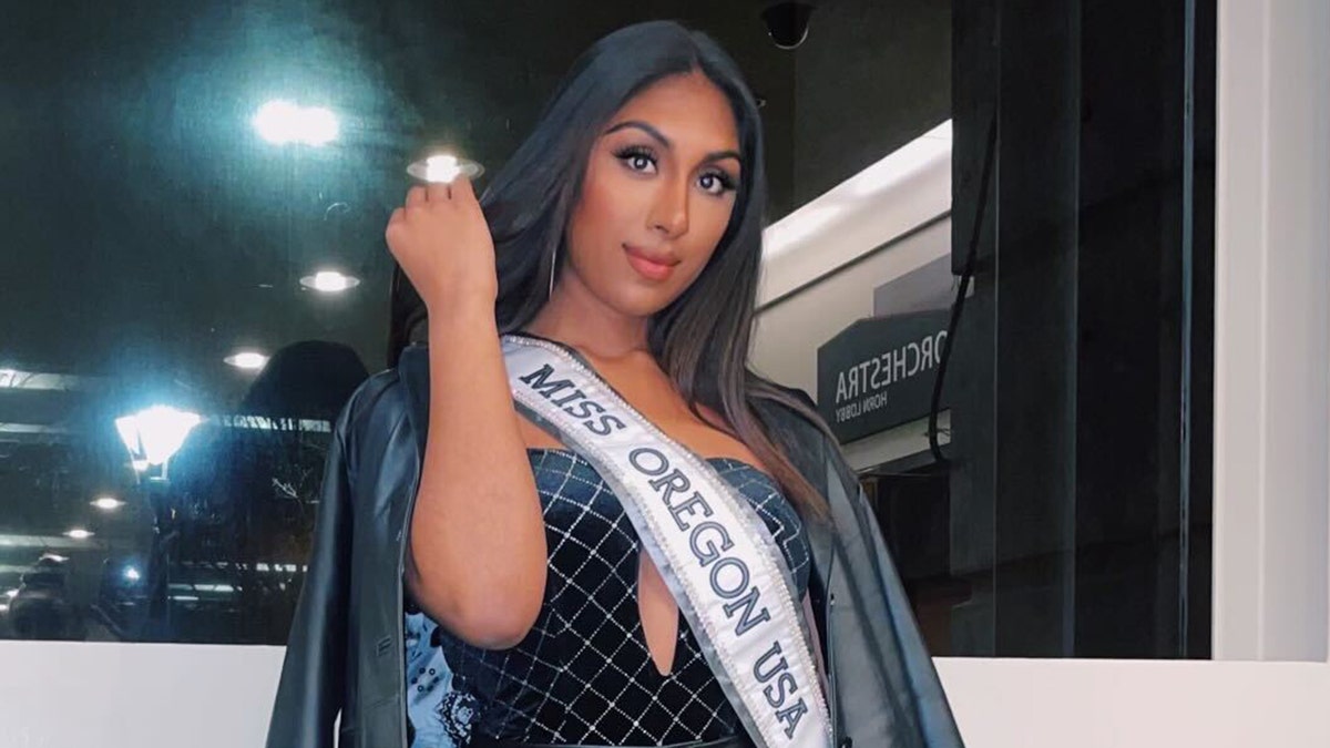 Manju Bangalore posing with her Miss Oregon sash