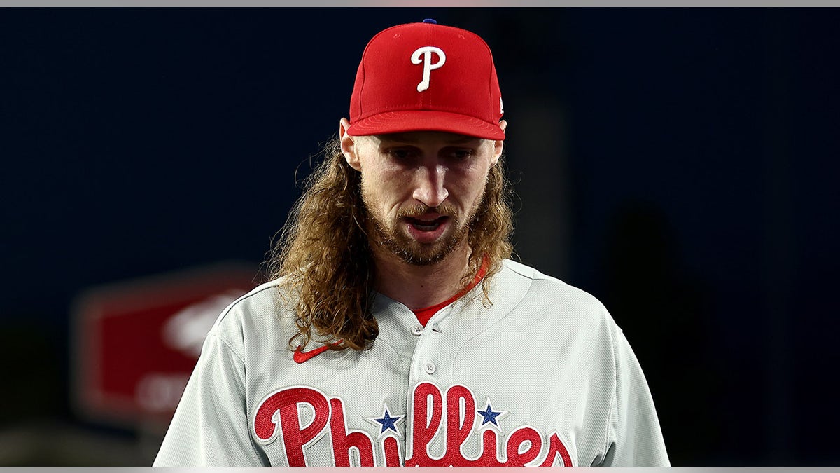 Matt Strahm with head down on field