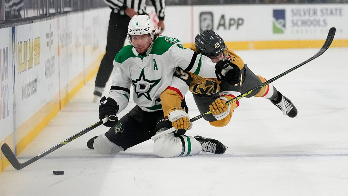 Miro Heiskanen fights for the puck