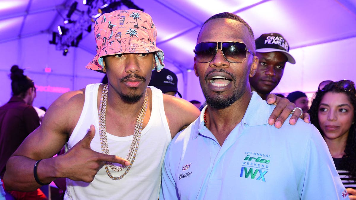 Nick Cannon and Jamie Foxx at a celebrity golf tournament