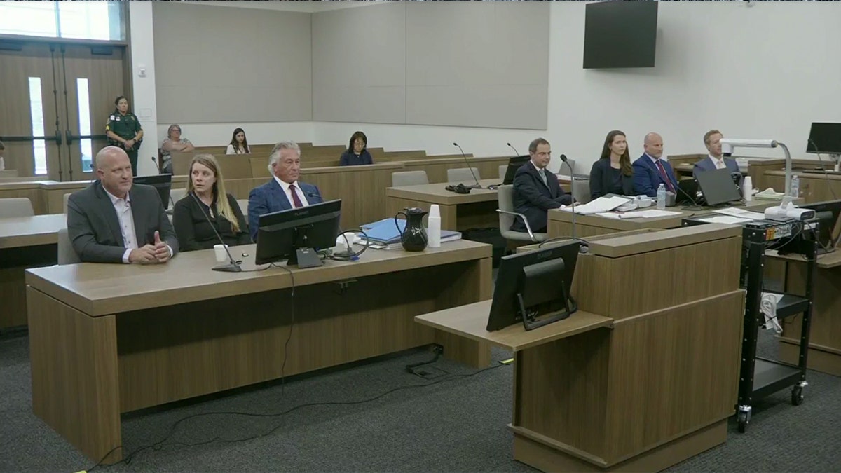 Gabby Petito's parents and their lawyer Pat Reilly on left