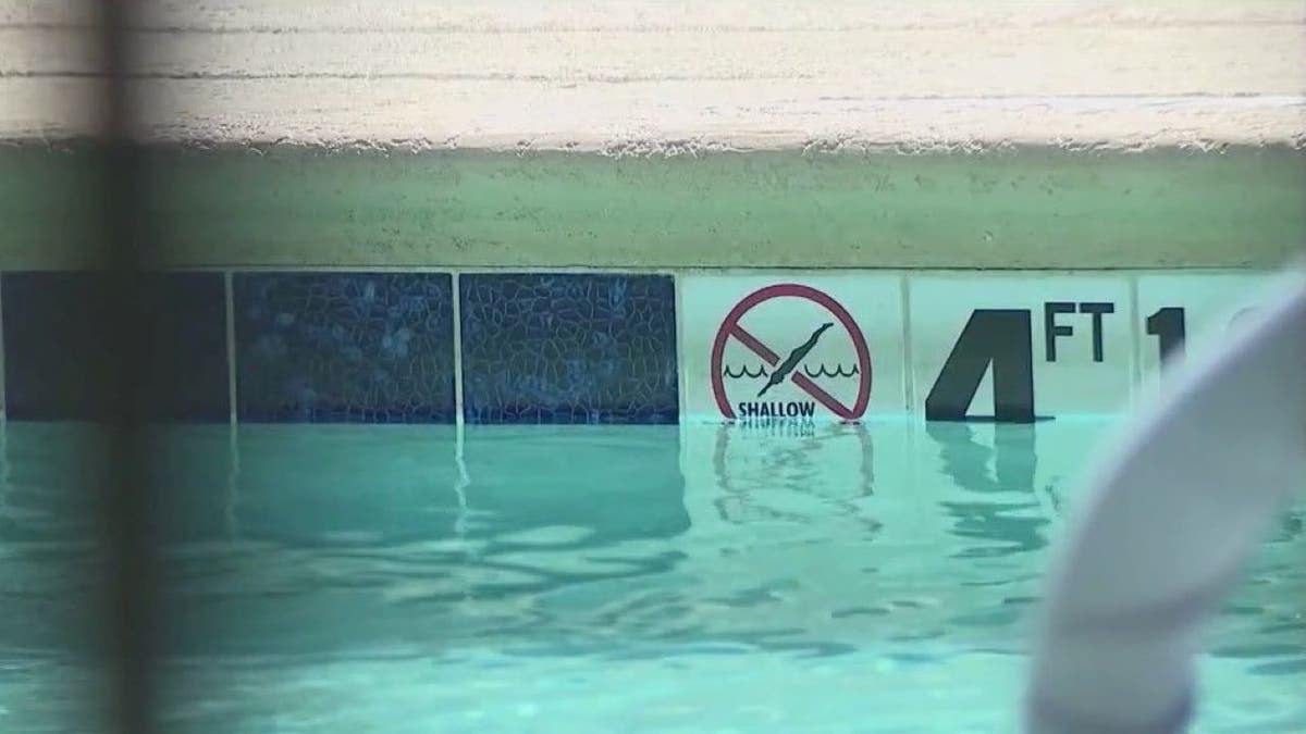 Pool sign at Phoenix hotel where child drowned