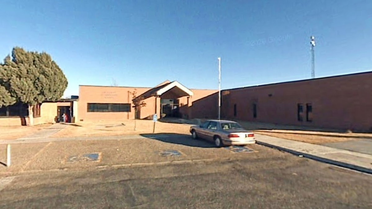 school parking lot and building