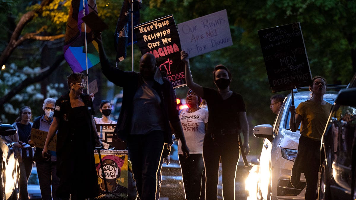 Abortion-rights advocates stage a protest outside the home of U.S. Associate Supreme Court Justice Brett Kavanaugh on May 11, 2022 in Chevy Chase, Maryland.