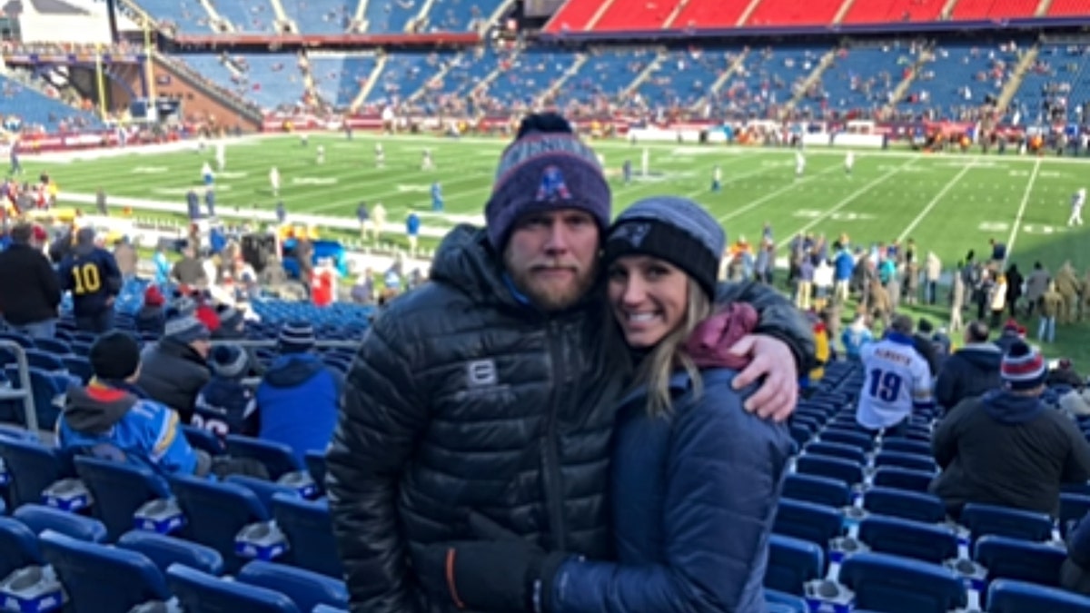 Eric and Kouri Richins at football game