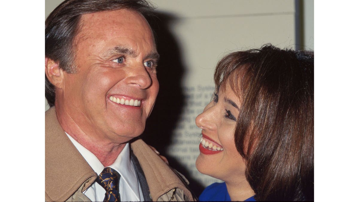 John Roland with co-anchor Rosanna Scotto