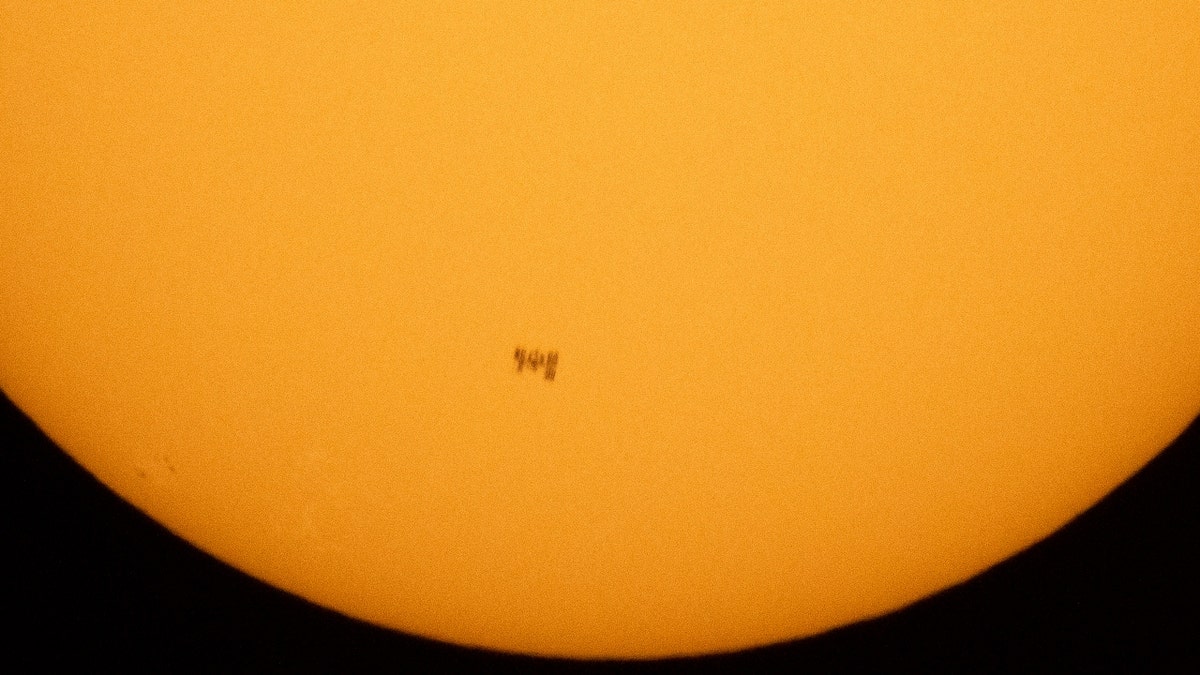 The International Space Station in front of the sun
