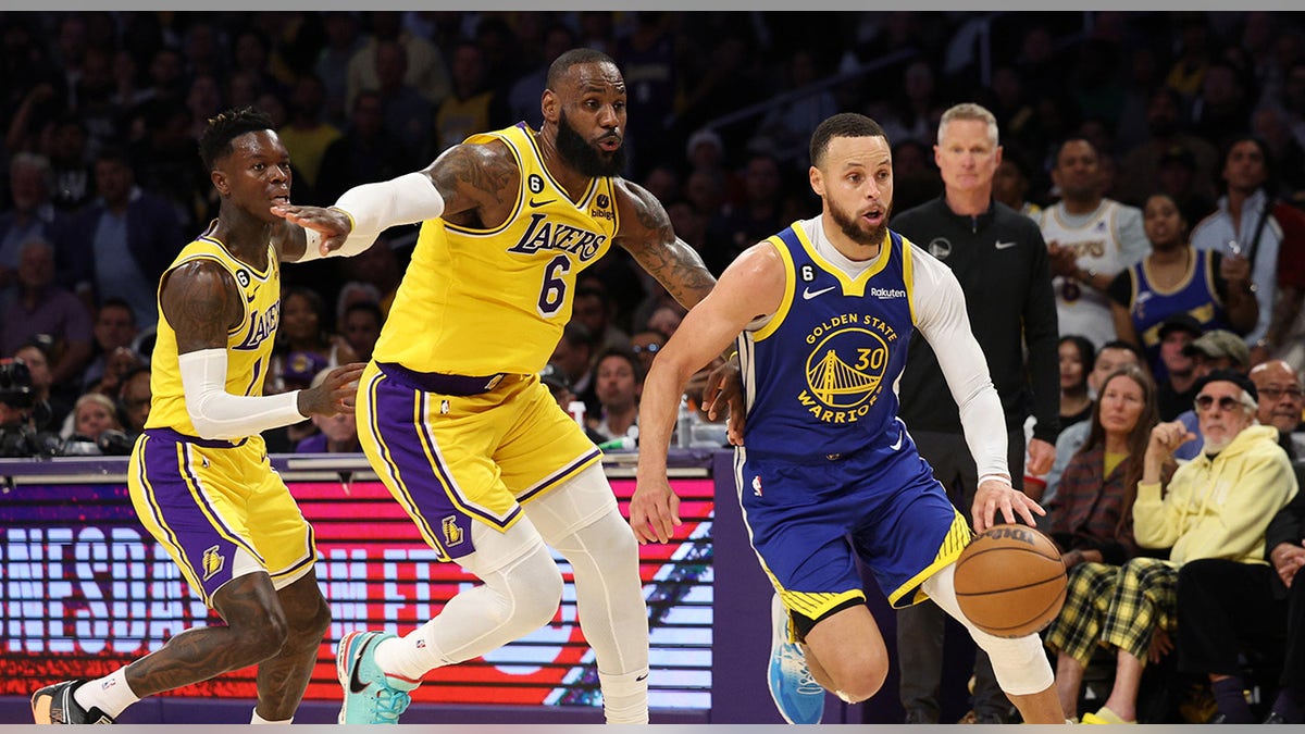 Stephen Curry drives to basket
