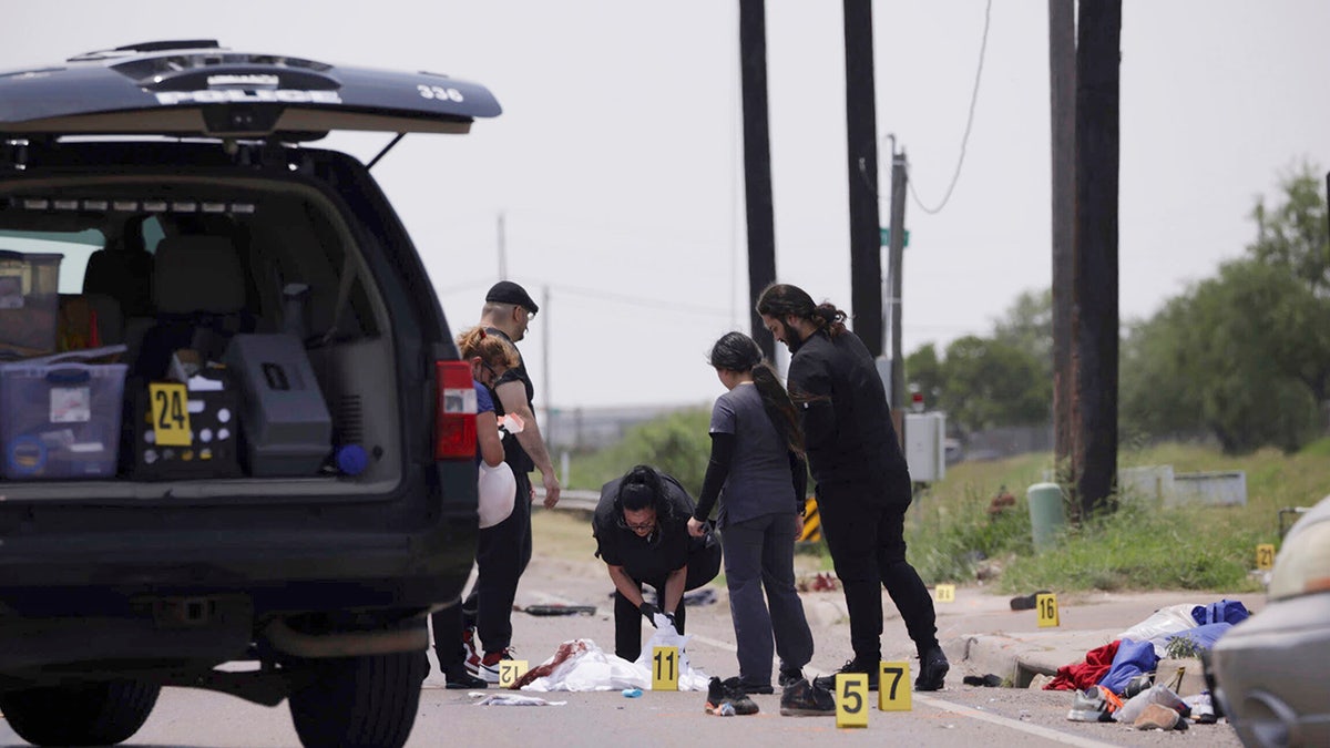 investigators at crash scene