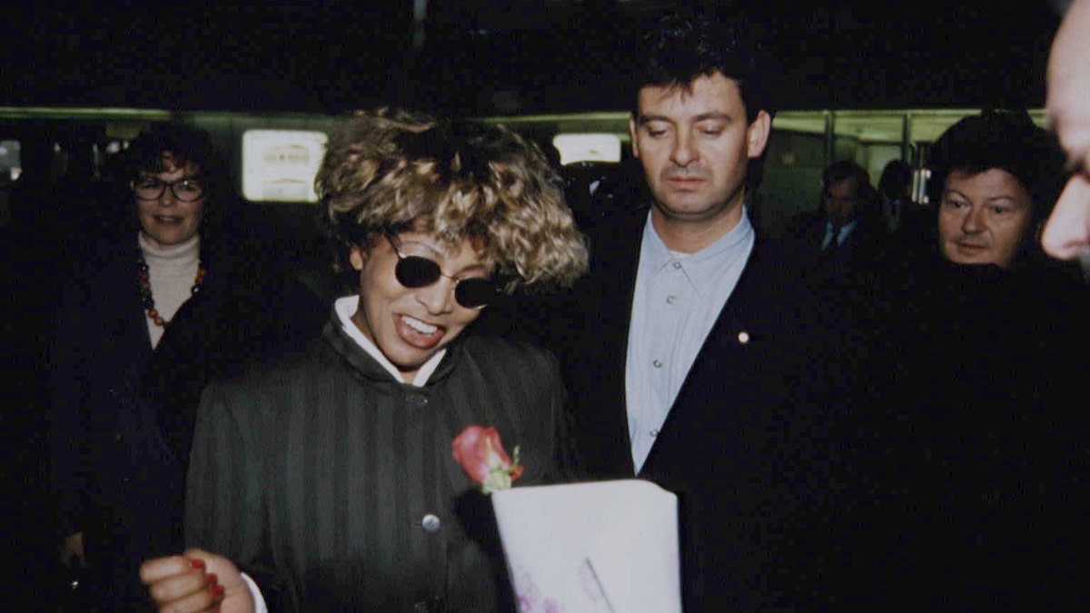 Tina Turner wears sunglasses next to Erwin Bach, who became her husband