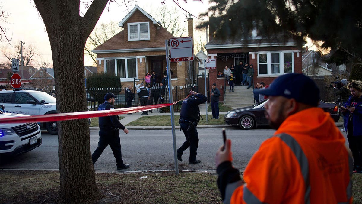 Chicago police walking through a crime scene.