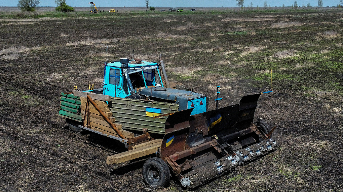 Ukraine tractor scans for Russian mines