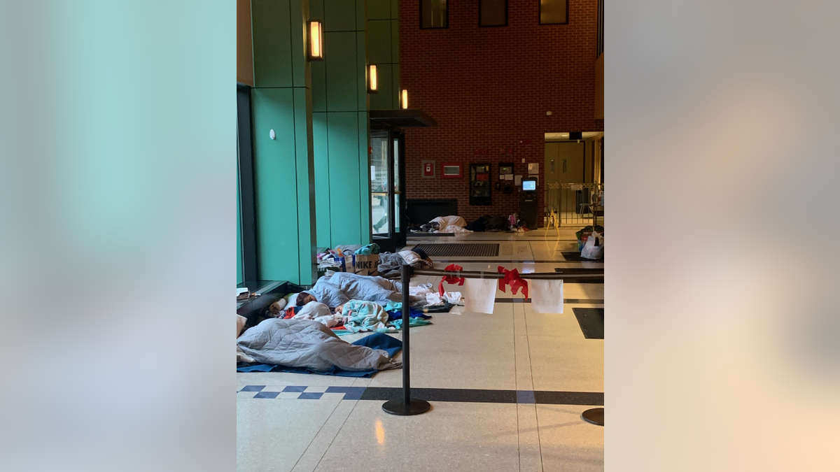 Migrants sleeping on police station floor