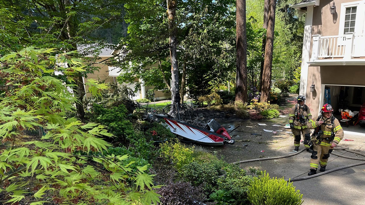 firefighters working scene of crash