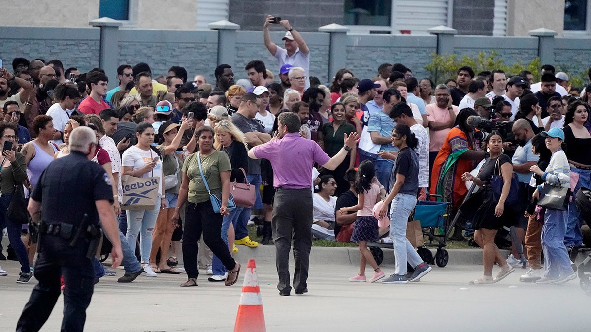 people gathering outside mall