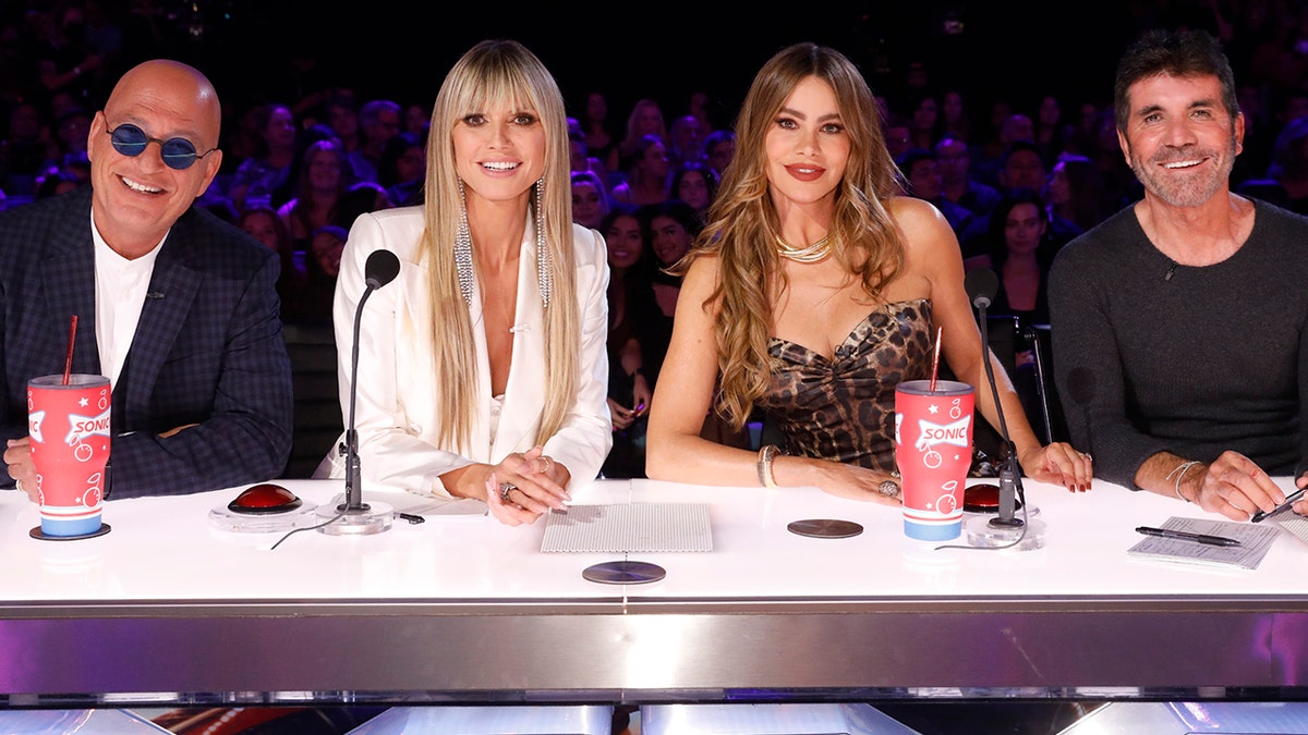 Howie Mendel, Heidi Klum, Sofia Vergara, Simon Cowell behind the judging panel at America's Got Talent