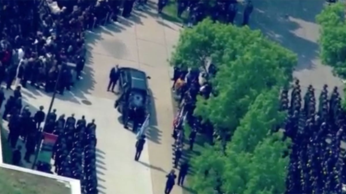Police officers line up outside church during Areanah Preston funeral