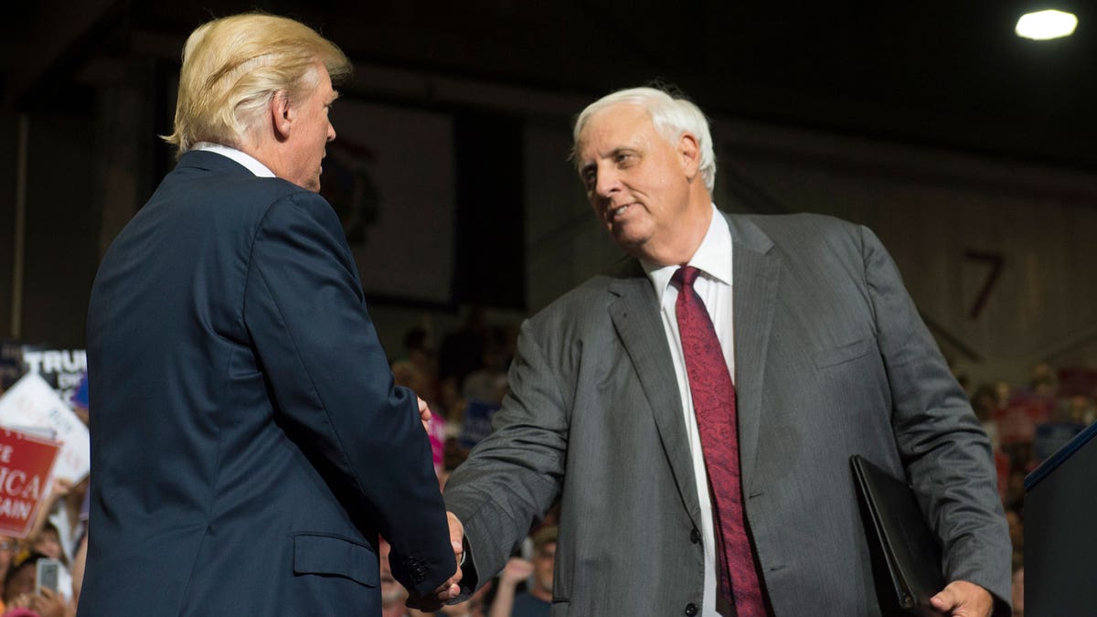 Republican West Virginia Gov. Jim Justice and President Donald Trump shake hands