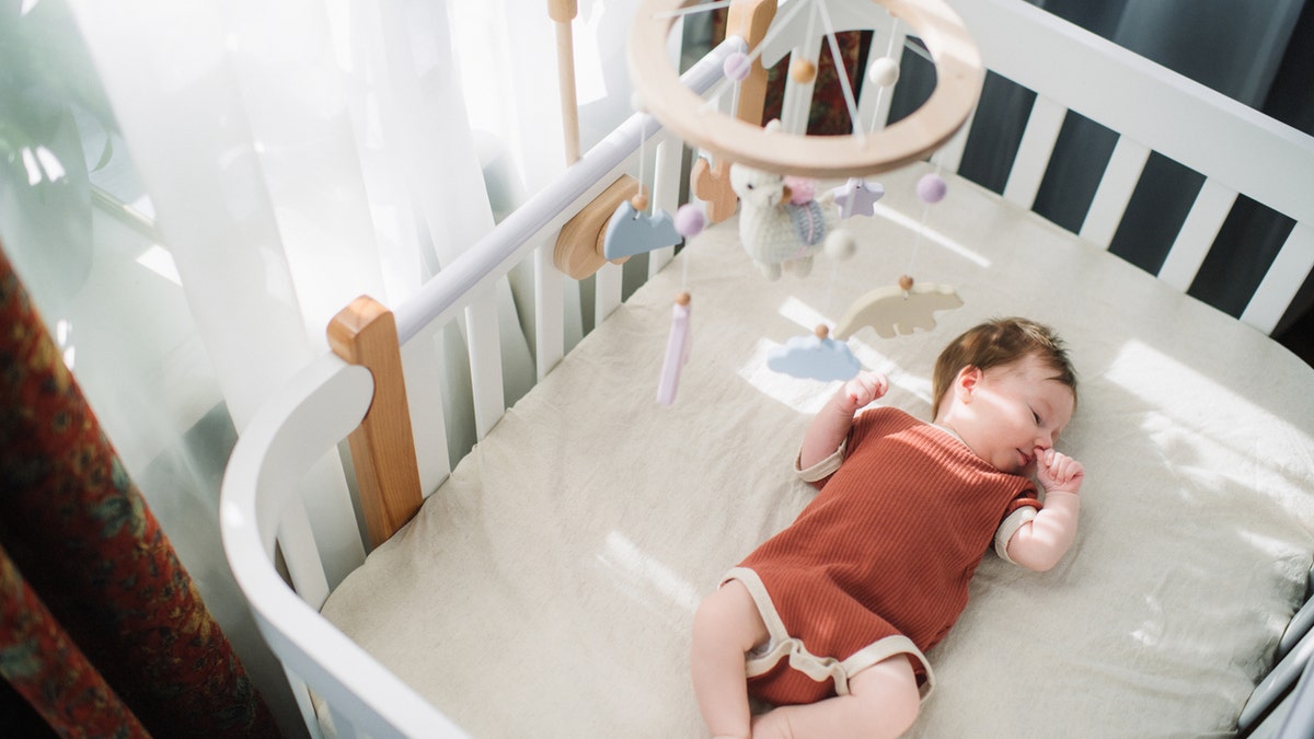 newborn baby in cradle