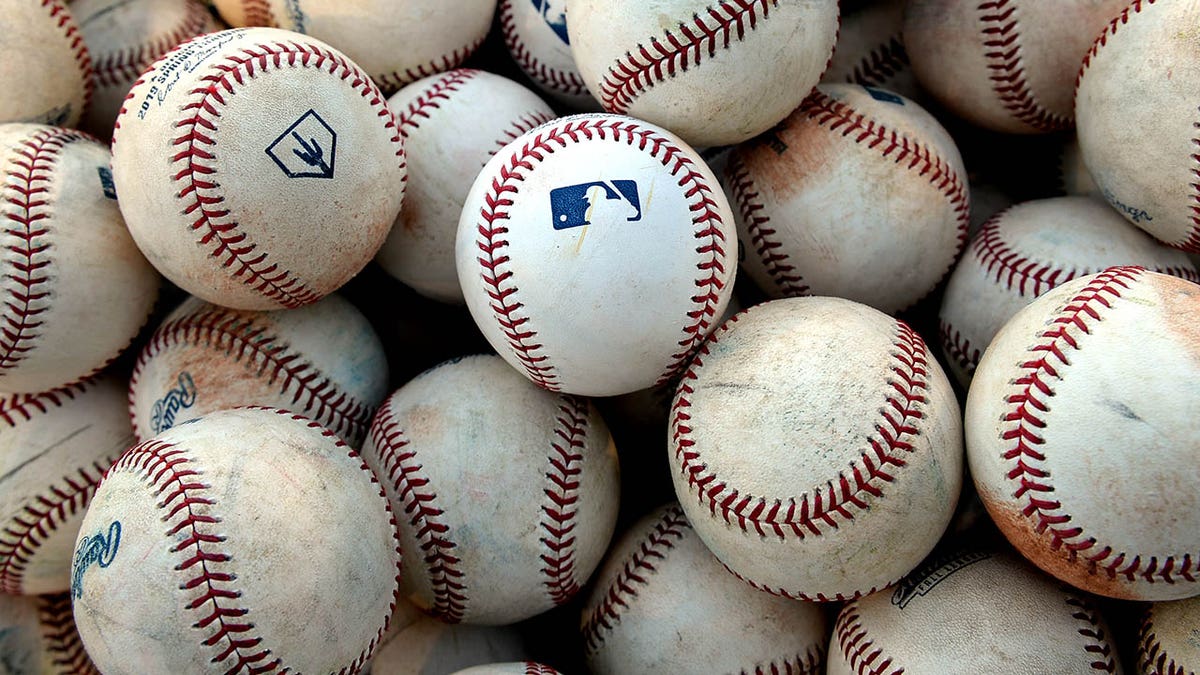 Bucket of MLB baseballs
