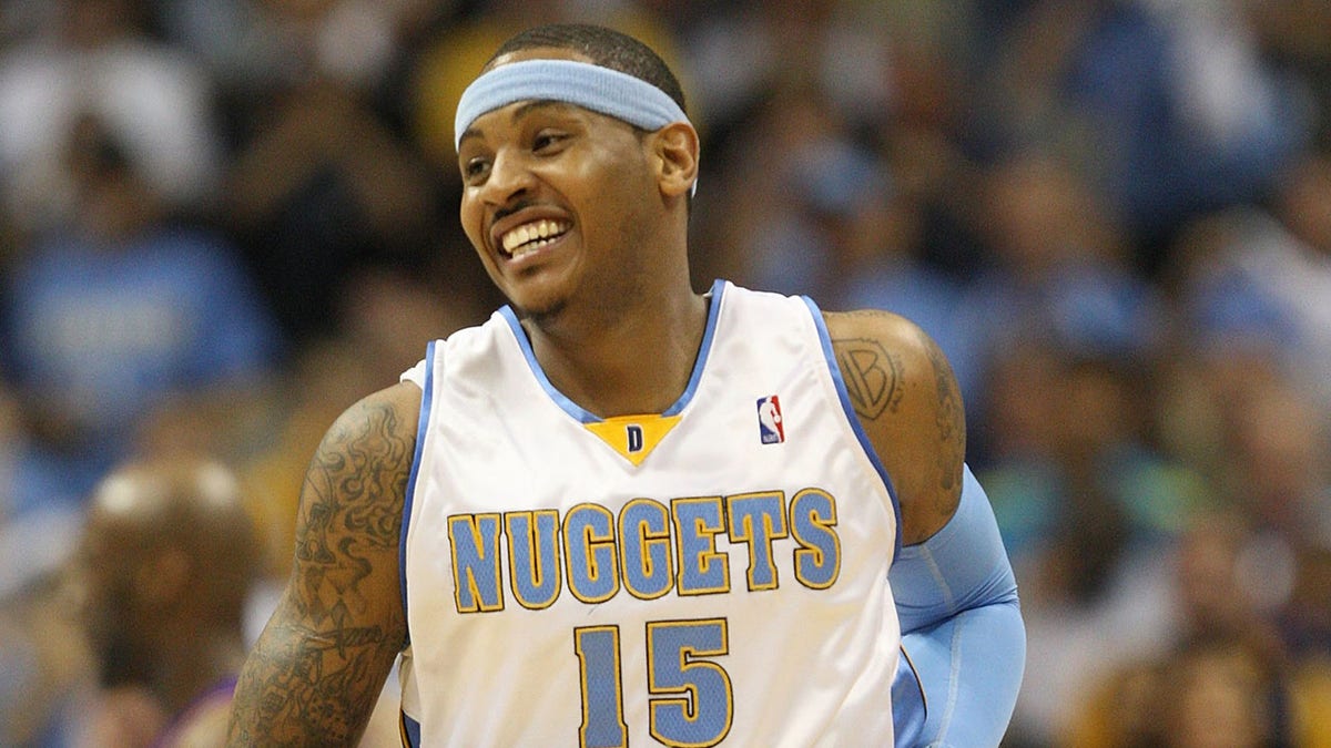 Carmelo Anthony smiles on court