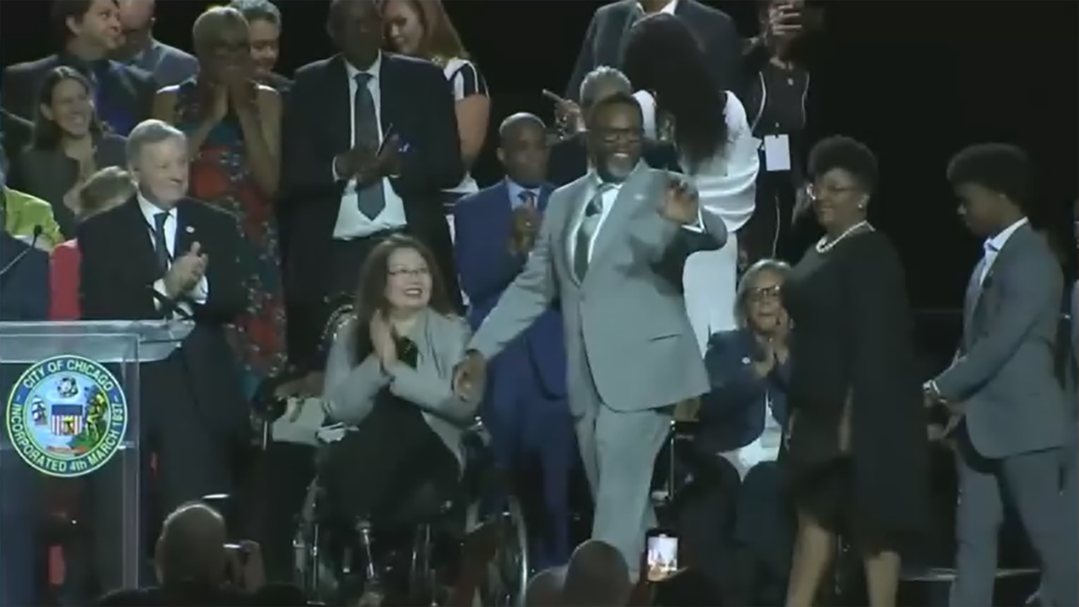 Chicago's new Mayor Brandon Johnson waves to crowd