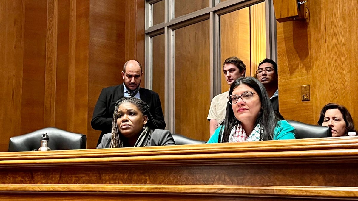 Cori Bush sits next to Rashida Tlaib in Senate hearing room