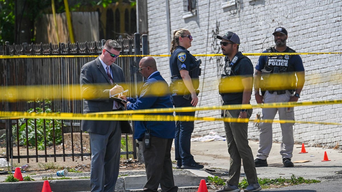 Baltimore Police investigate the scene of an officer-involved shooting in the Shipley Hill neighborhood of Baltimore on May 11, 2023. 