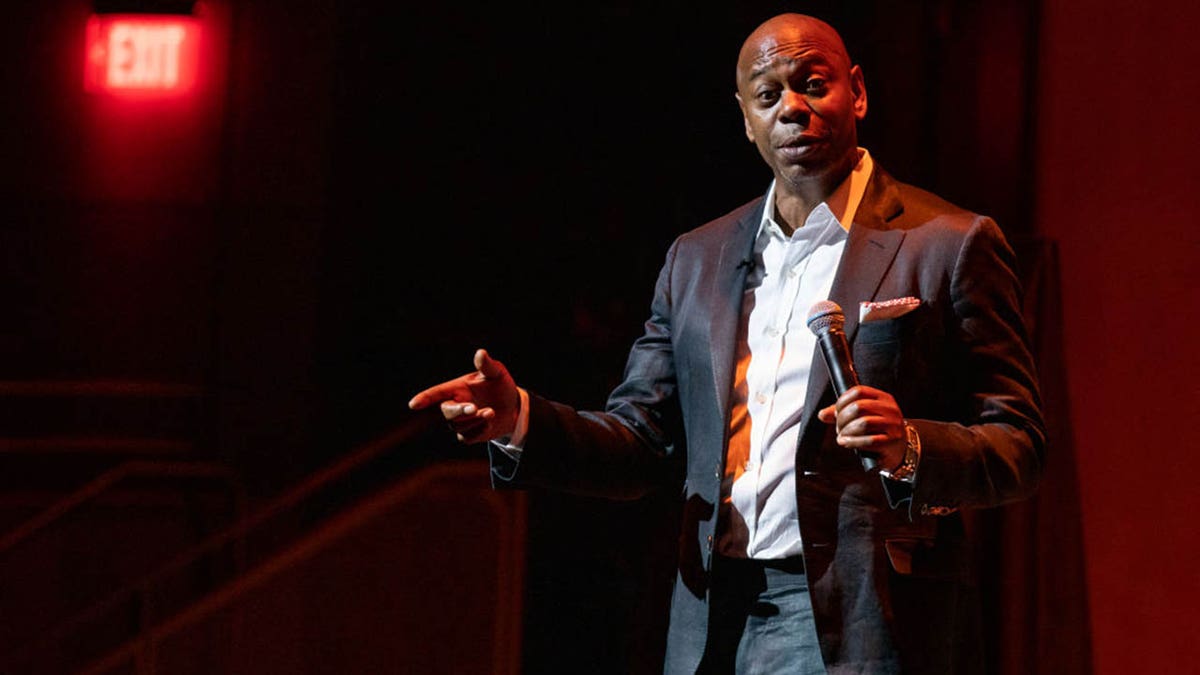 dave chappelle on stage during comedy show